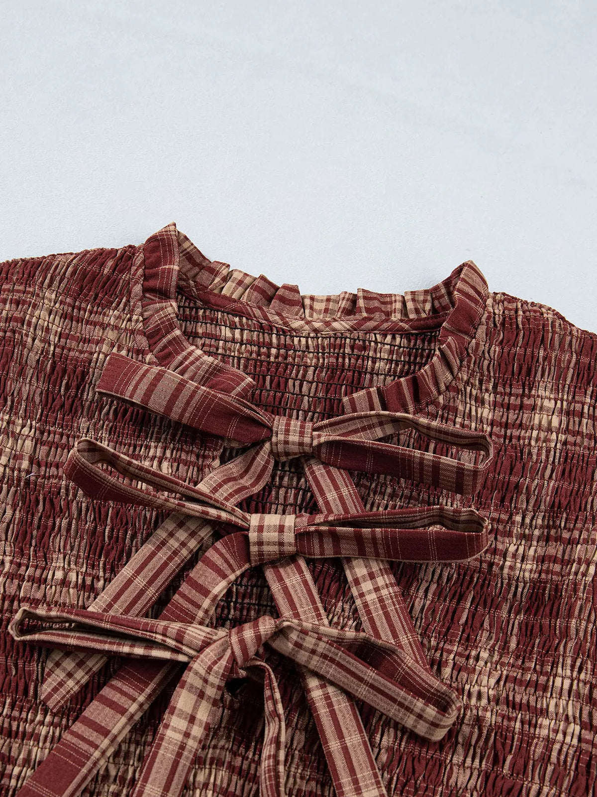 Plaid smocked dress, front bows close up