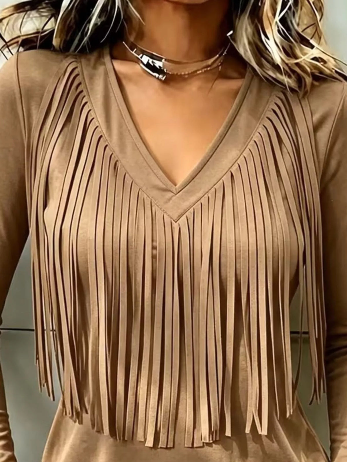 Tan fringe V-neck top, neckline and fringe close-up