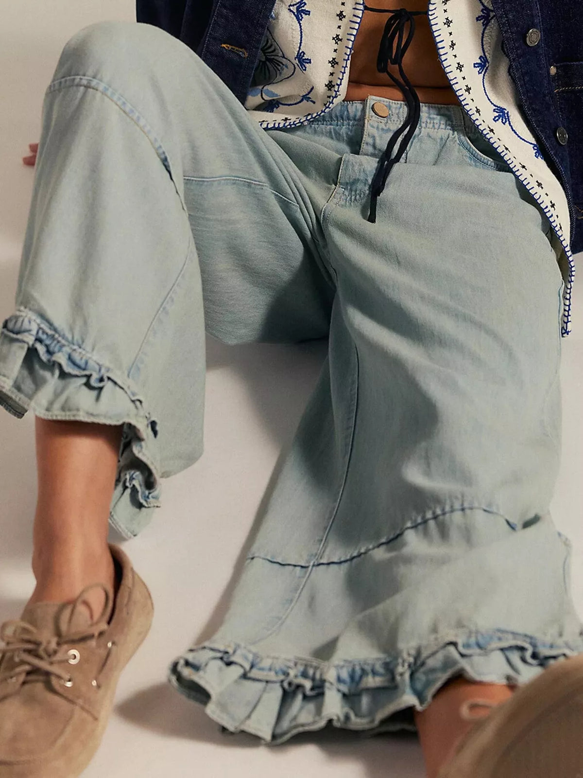 Light blue wide-leg ruffle-hem jeans