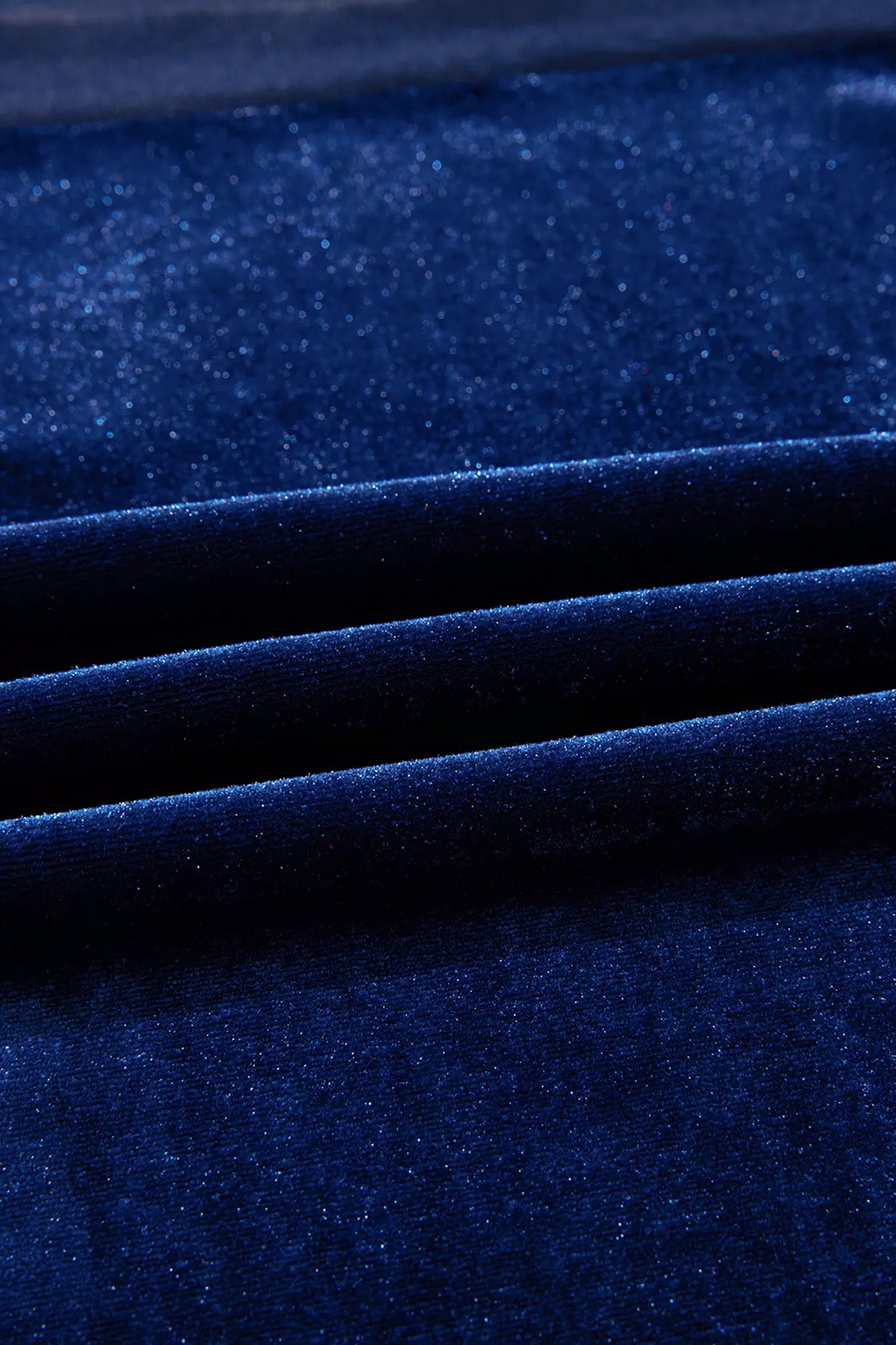 Navy velvet top with sheer yoke and long sleeves, velvet fabric close-up.