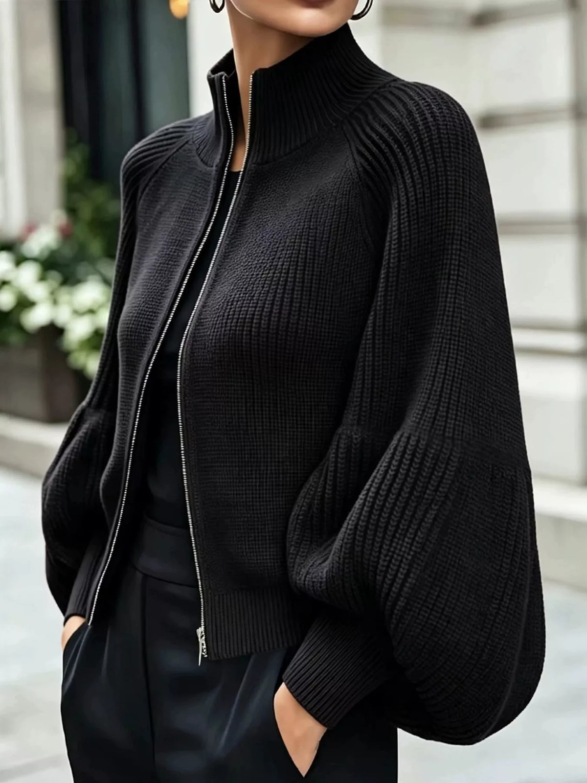Black ribbed knit zip-up lantern sleeve cardigan