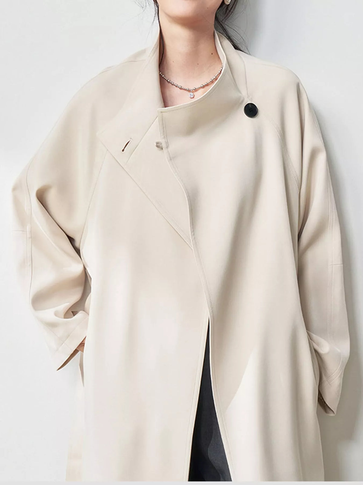 Asymmetric Button Longline Trench Coat, detail view in cream