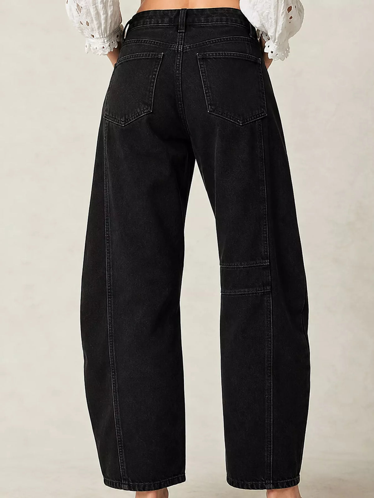 Black barrel-leg jeans, back view