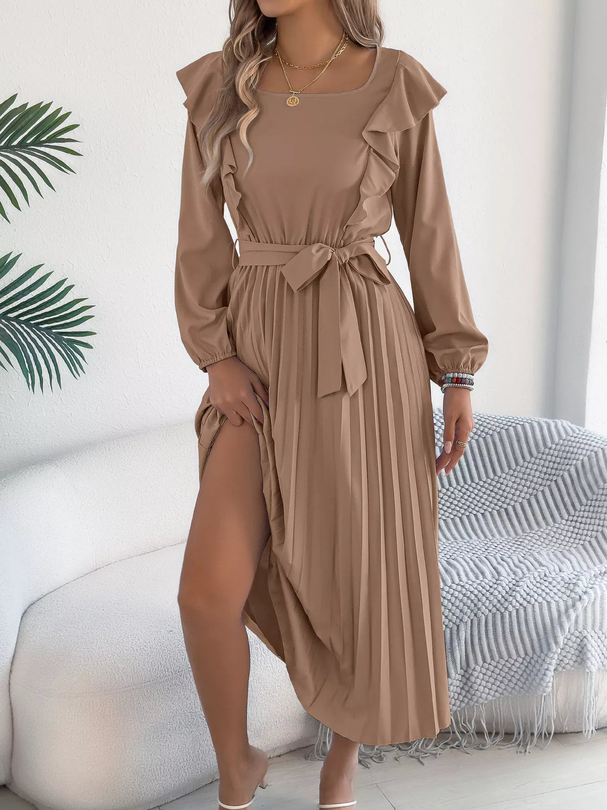Taupe ruffled pleated tie-waist midi dress, front with skirt lifted.