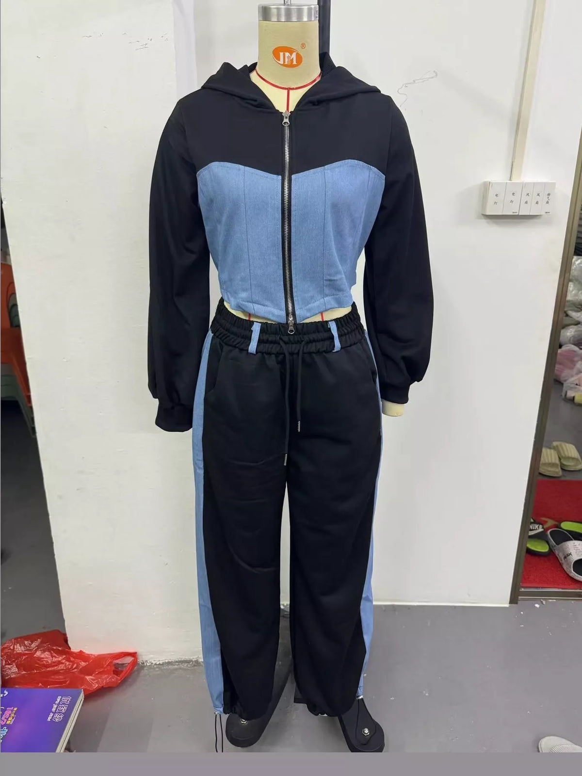 Navy and light blue color-block zip-up hoodie and wide-leg pants set — front view