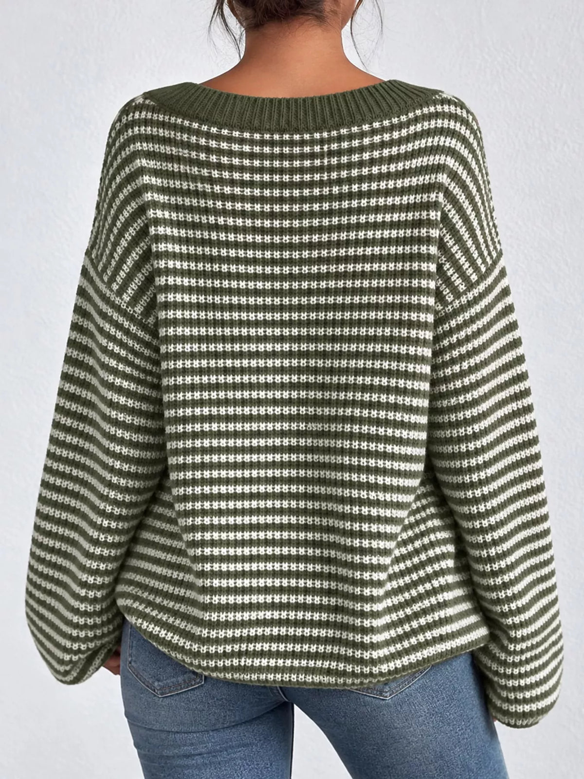 Green and white striped knit boat neck sweater, back view