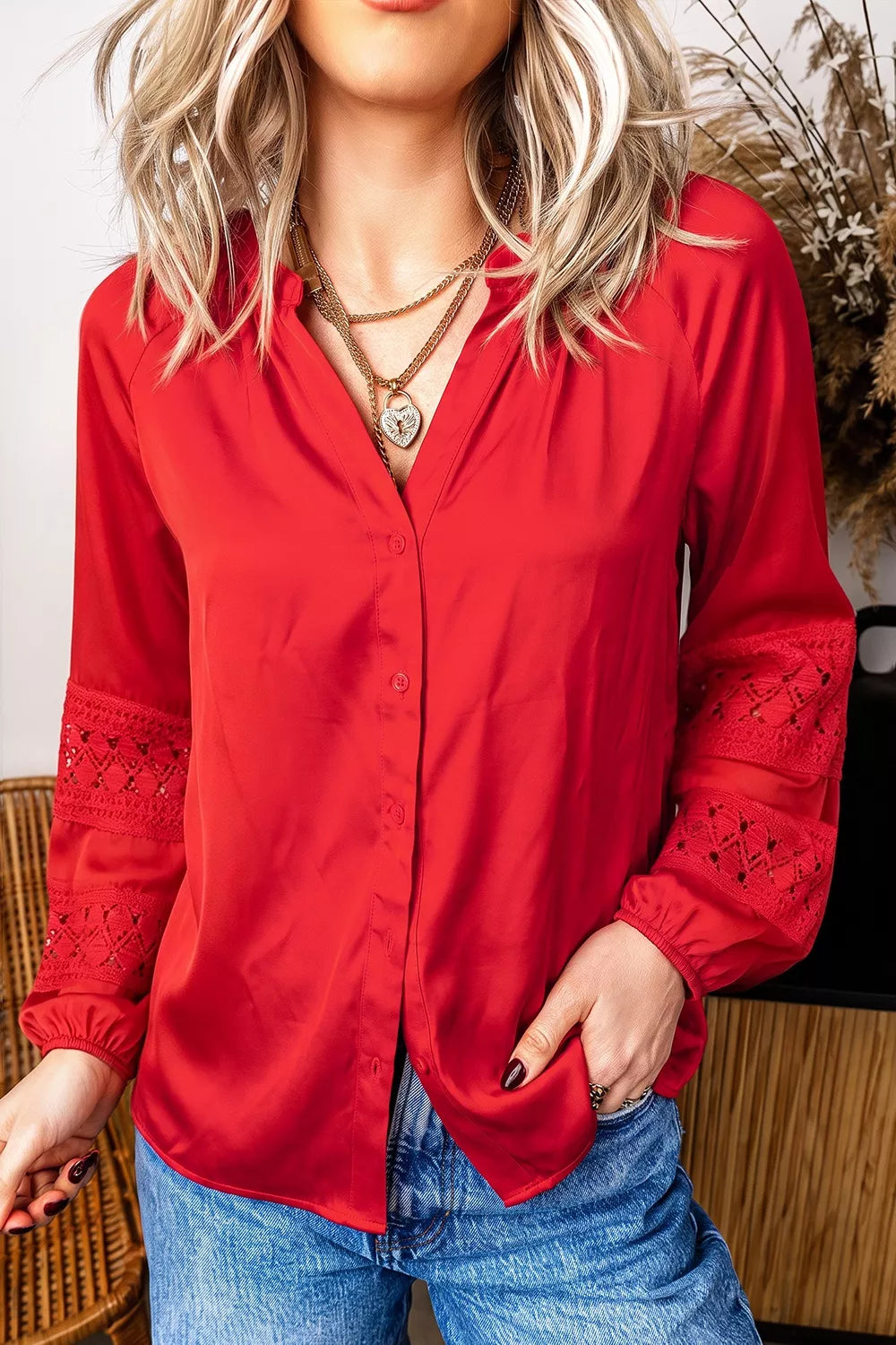 Red lace-panel v-neck button-front shirt, front view.