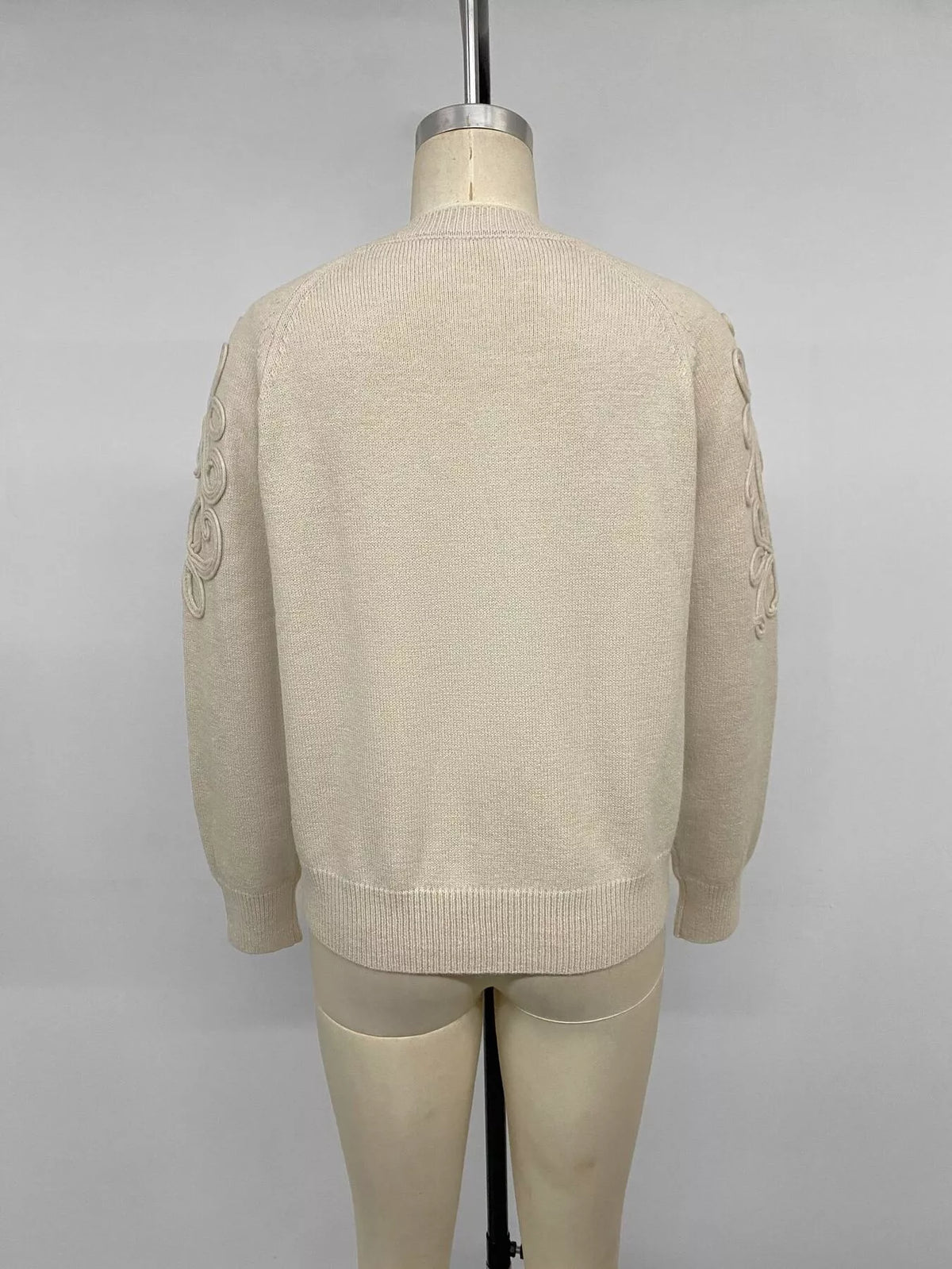 Cream floral raglan sleeve sweater, back on mannequin