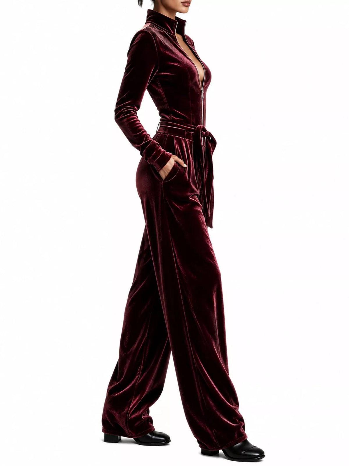 Burgundy velvet zip up jumpsuit with tie waist, side view