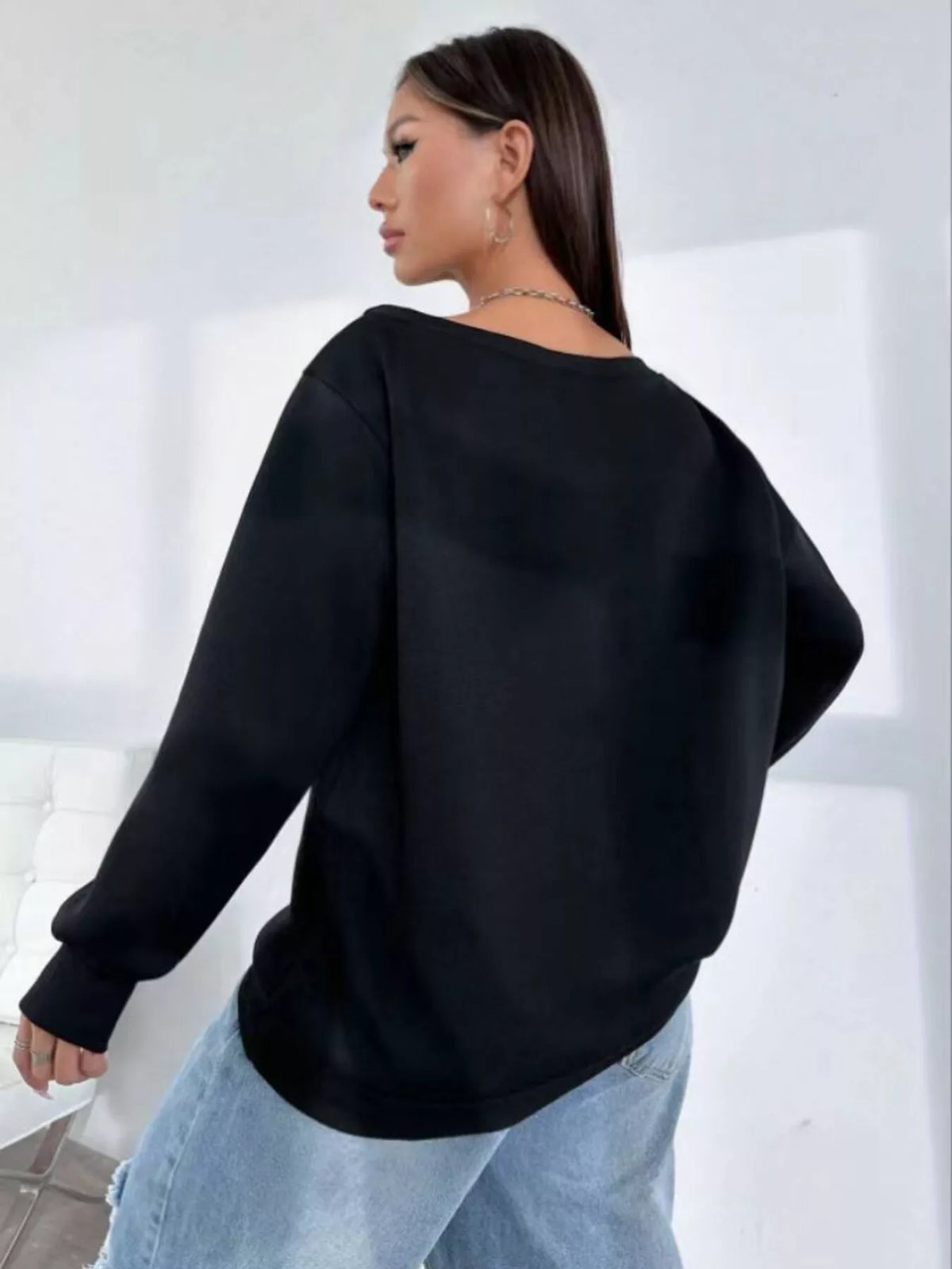 Black asymmetric-neck sweatshirt, back view