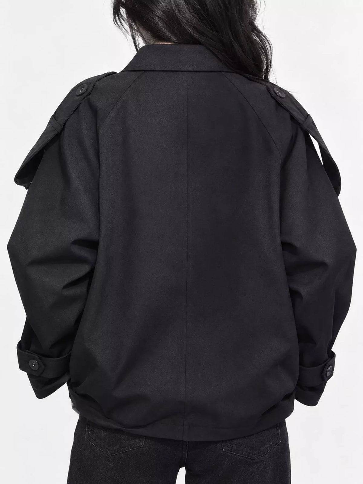 Black double-breasted cropped trench jacket, back view