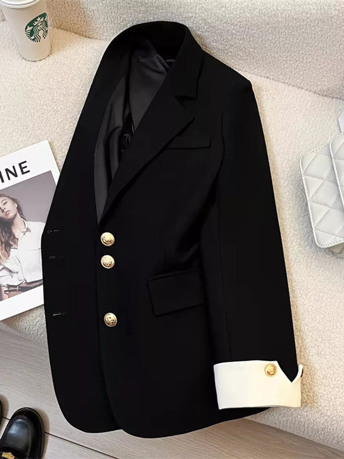 Black single-breasted blazer with gold-tone buttons