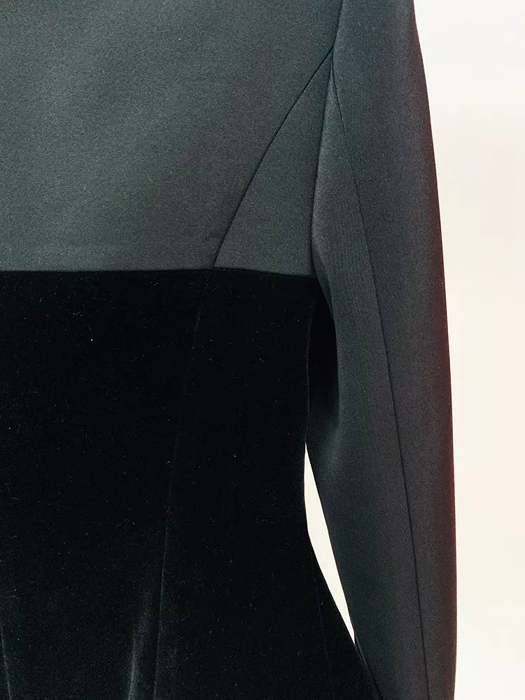 Black velvet-paneled blazer with stand-up collar, upper back, sleeve seam, and contrast panel