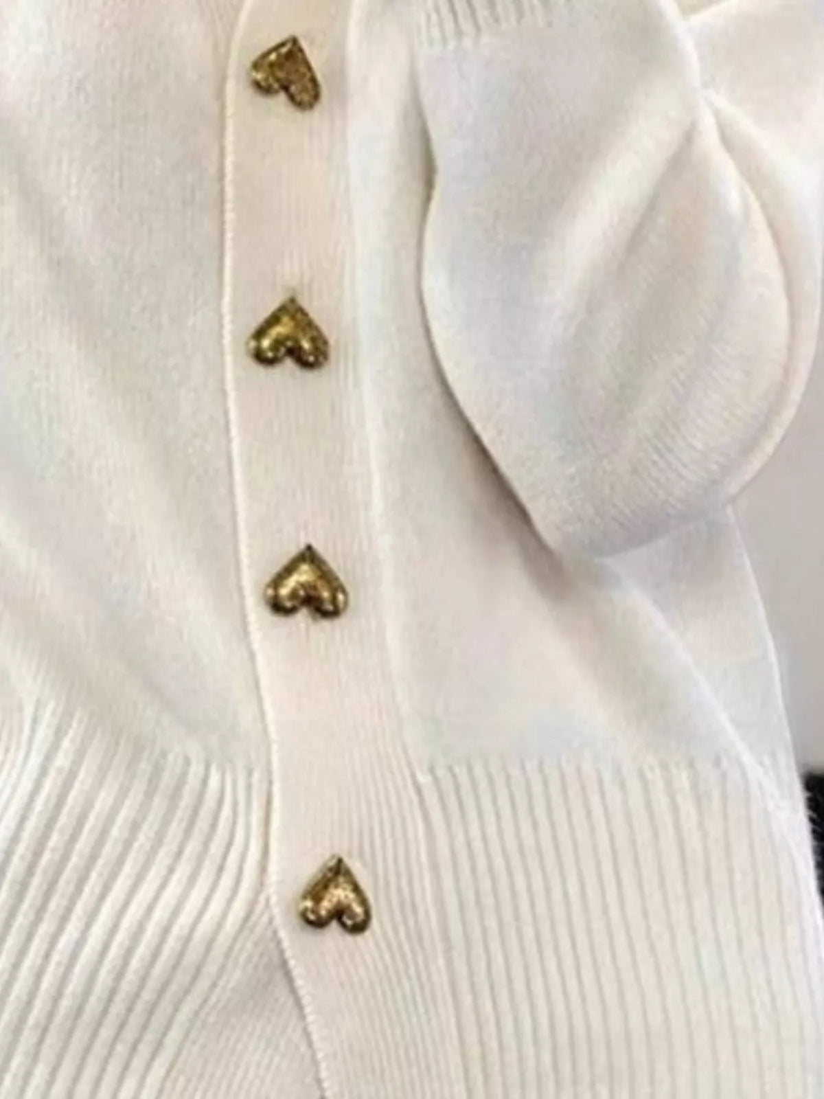 Women's V-Neck Cardigan with Gold Heart-Shaped Buttons in white — button detail view