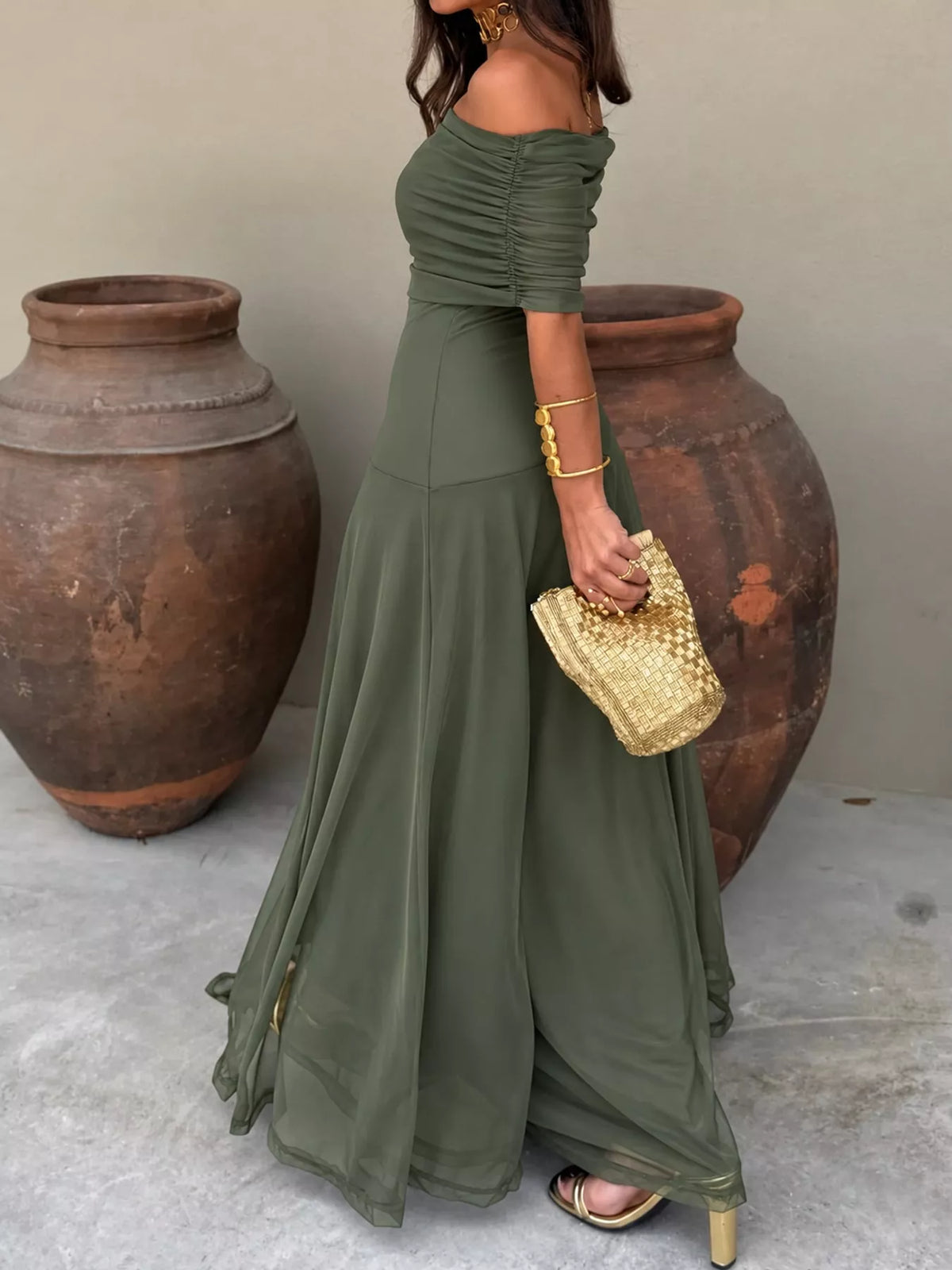 Green off-shoulder ruched maxi dress — front view
