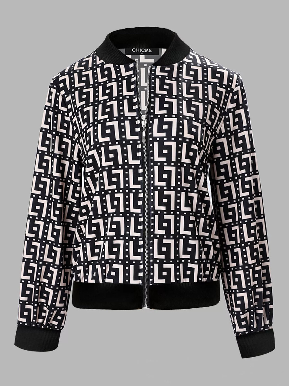 Black and white geometric printed zip-up bomber jacket — front view