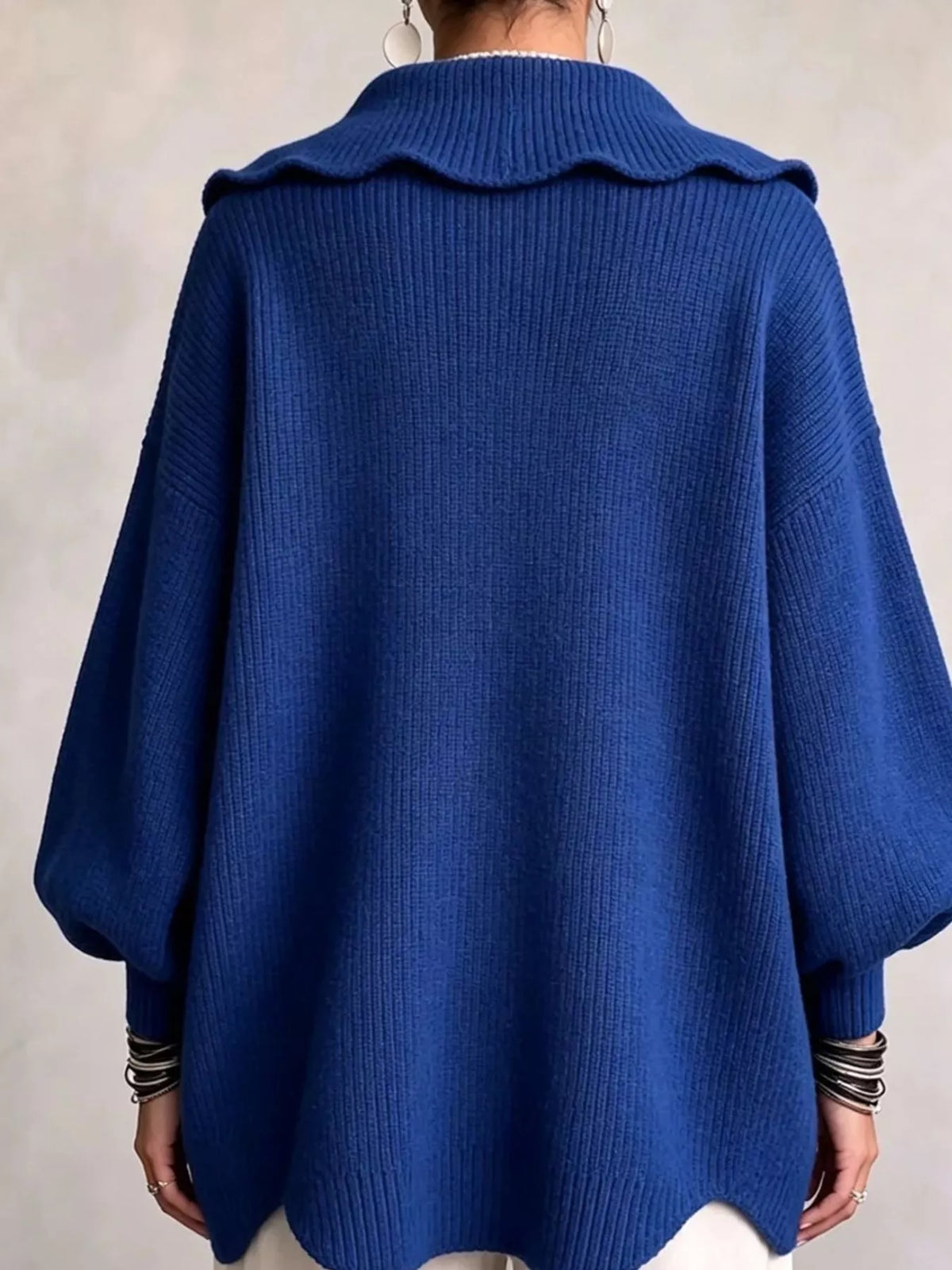 Blue scalloped-edge knit cardigan, back view
