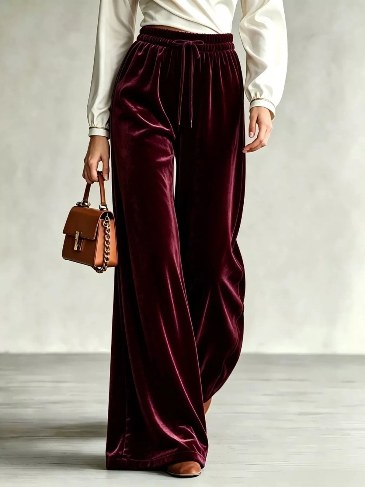 Burgundy wide-leg drawstring velvet pants, front view