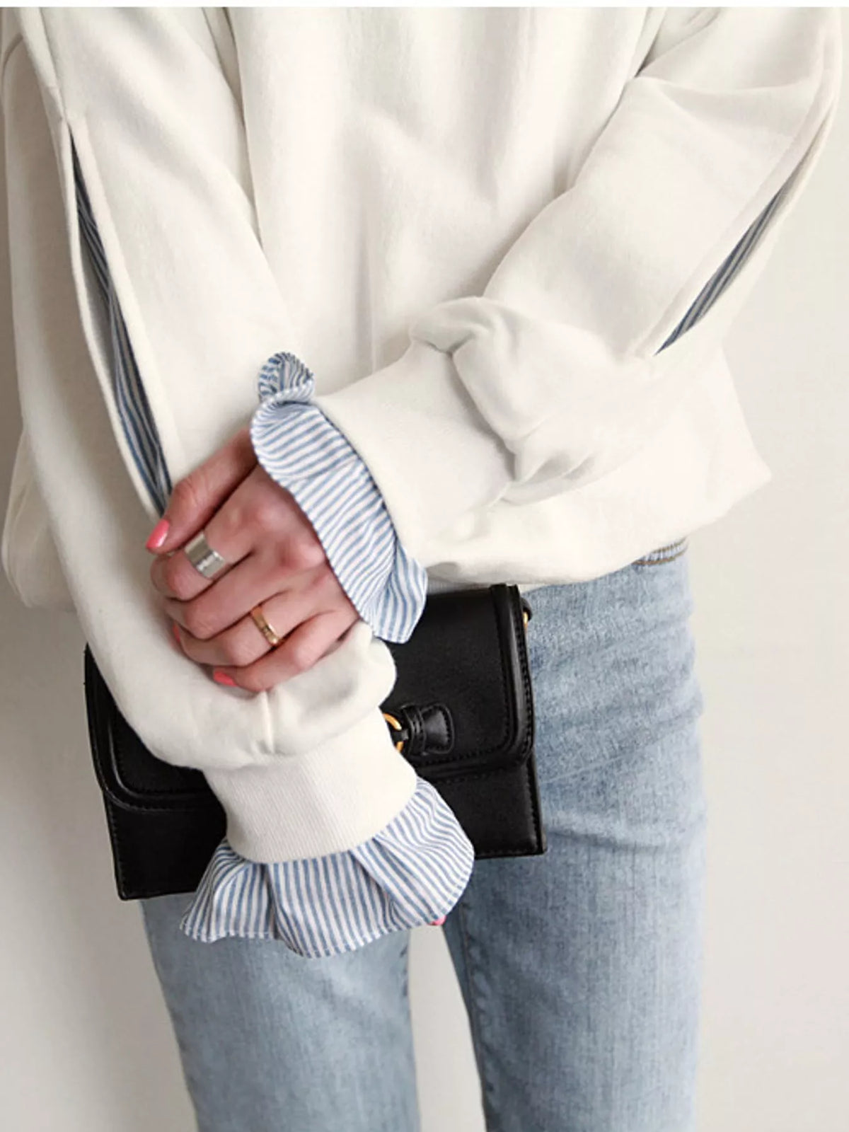 White crewneck sweatshirt with striped ruffle cuffs