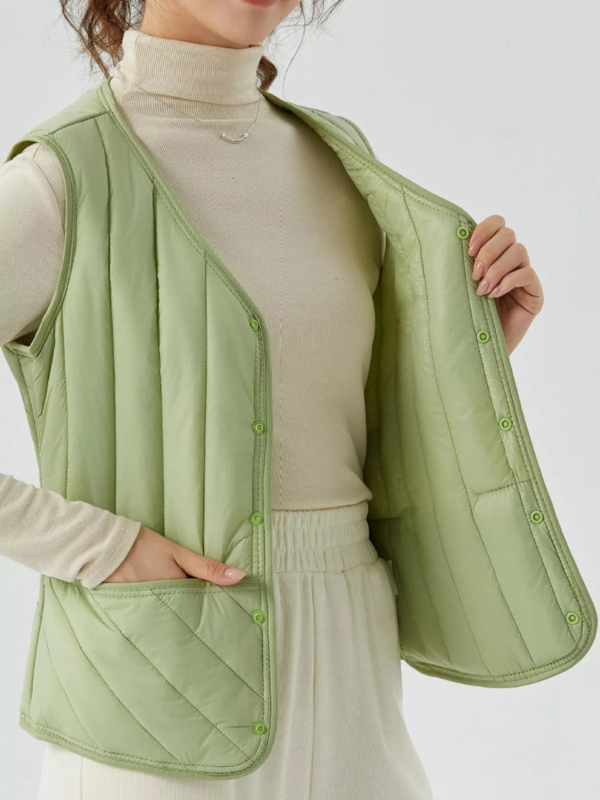 Quilted Button Up Vest in green, front view