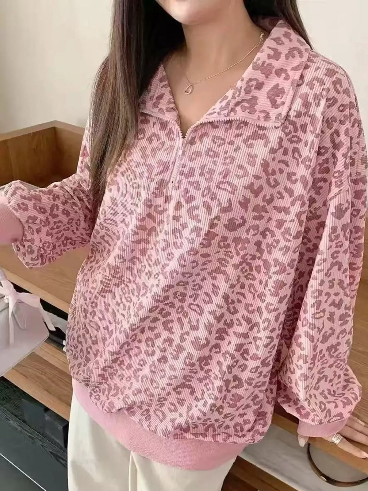 Pink leopard print quarter-zip sweatshirt