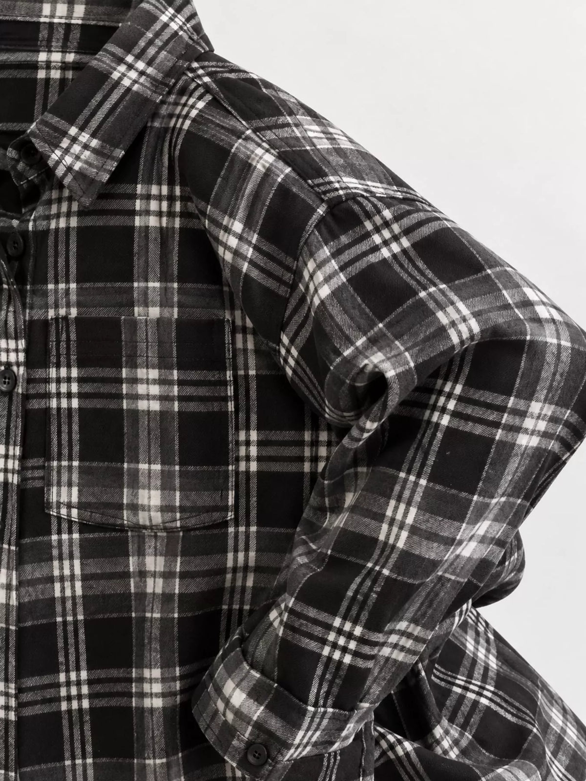 Black and white plaid button-up shirt with chest pockets