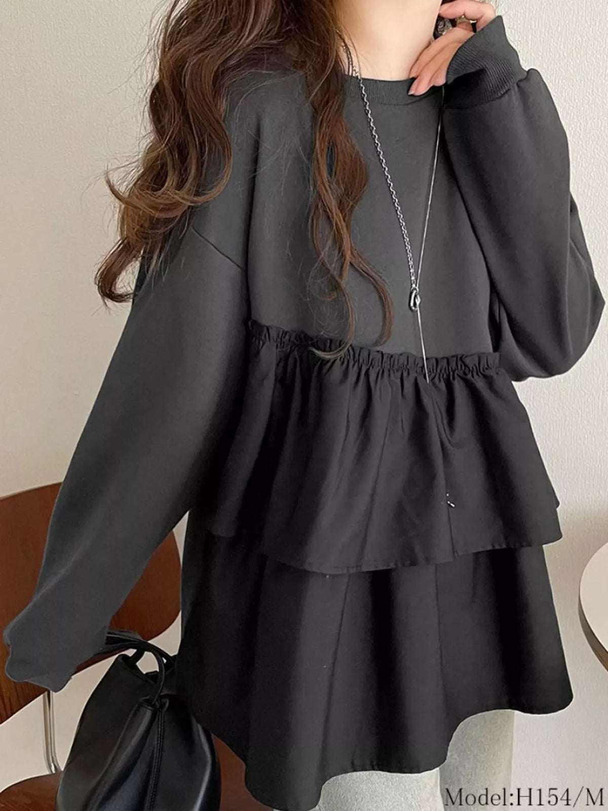 Black color-block ruffled hem top