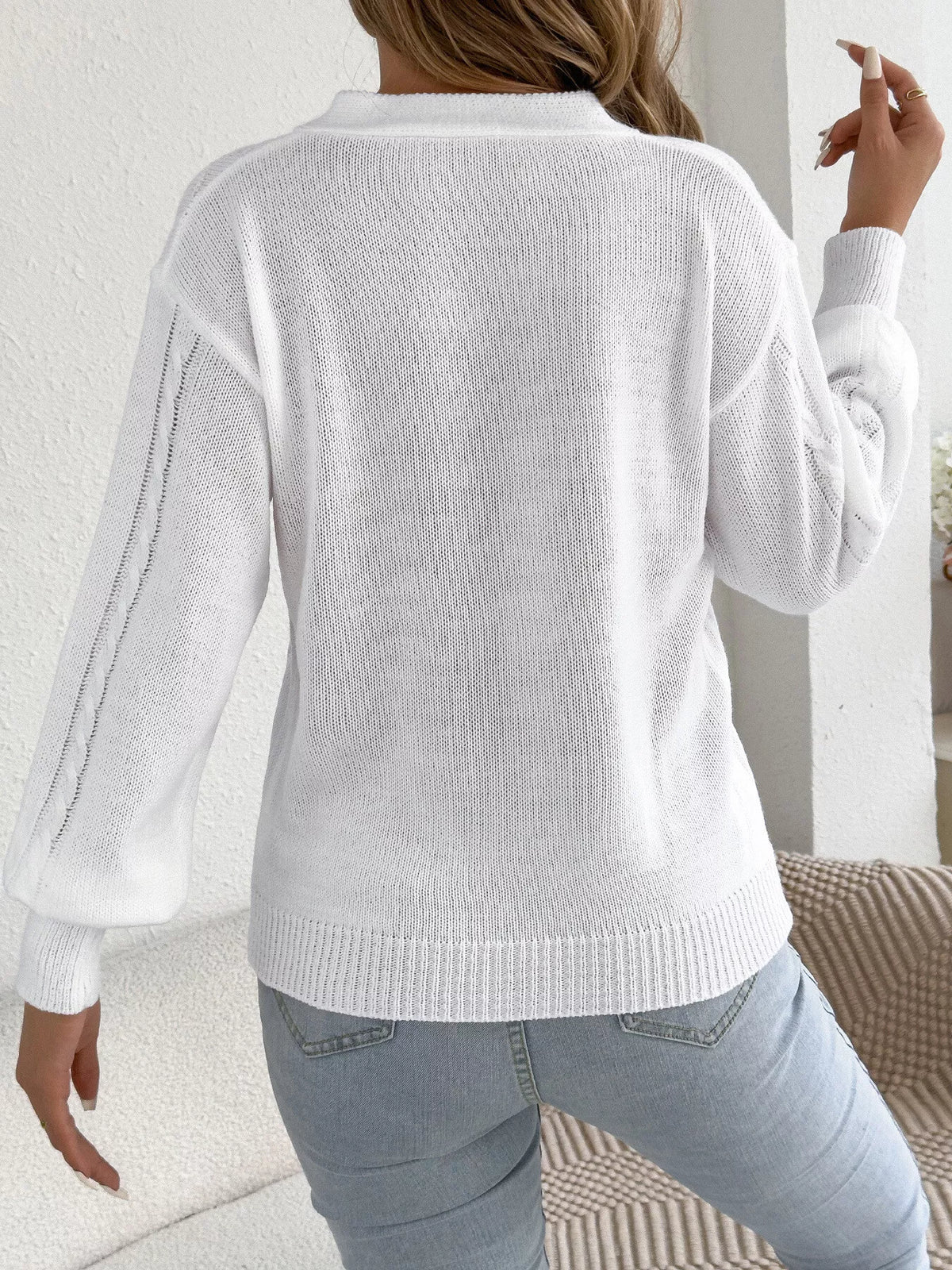 White cut-out cable knit sweater, back view