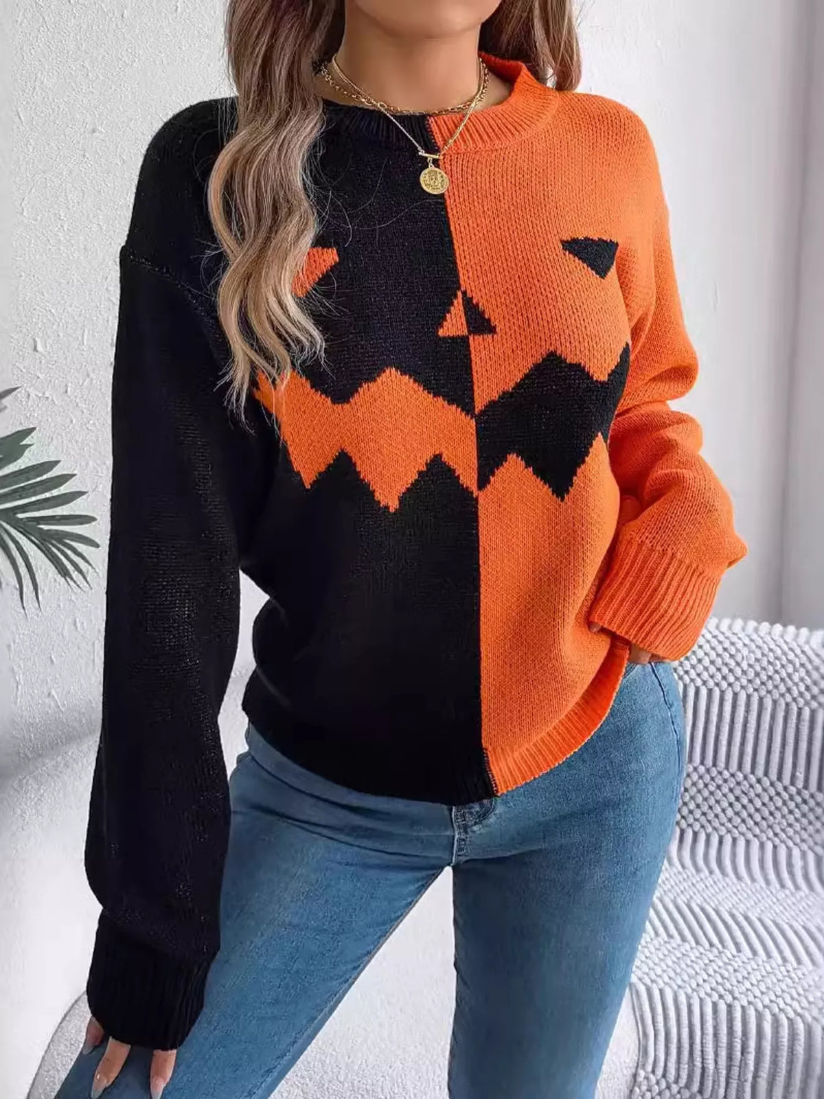 Pumpkin Face Graphic Two Tone Sweater in orange and black, front view