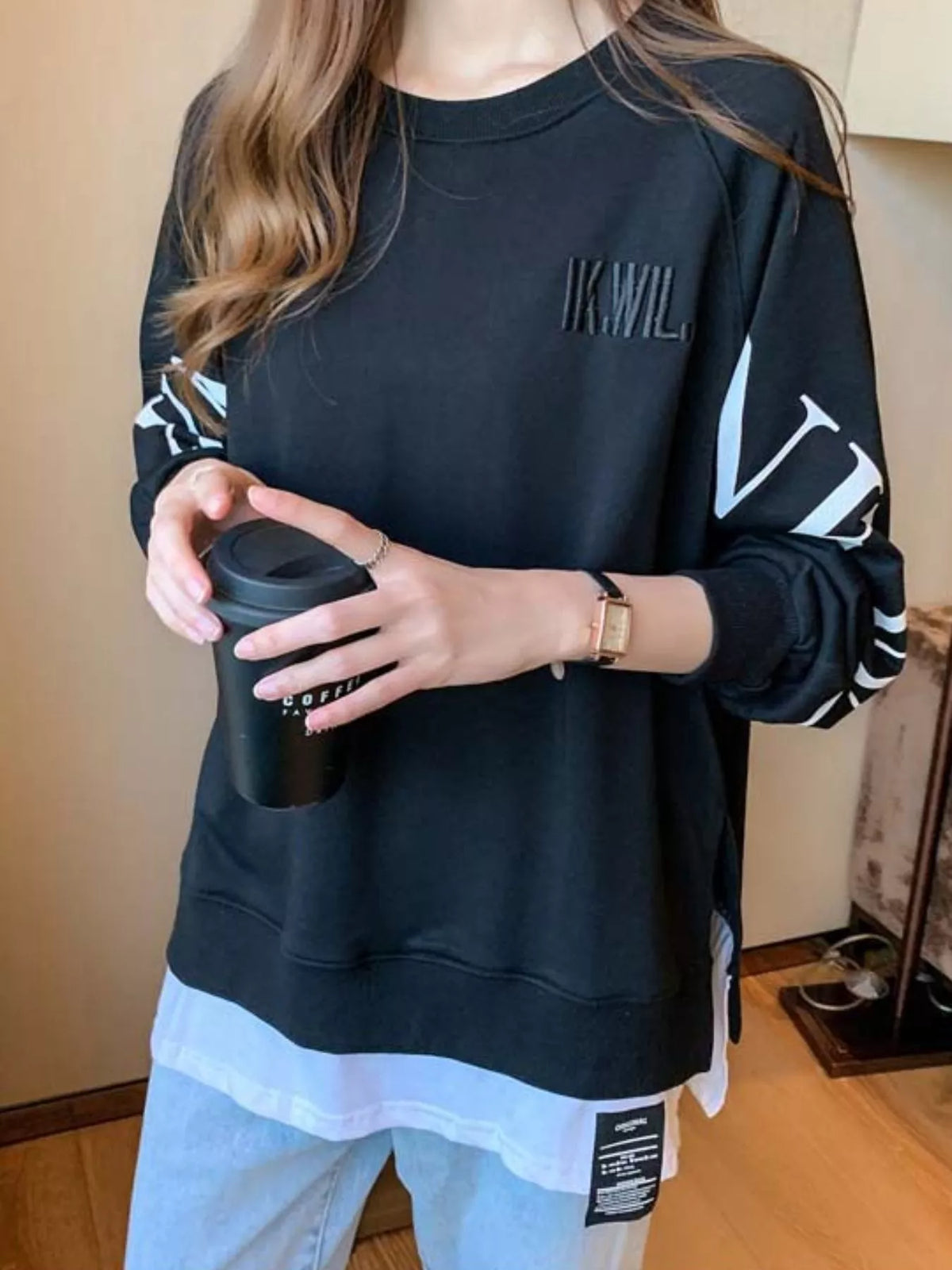 Black layered-hem sweatshirt with graphic sleeve detail