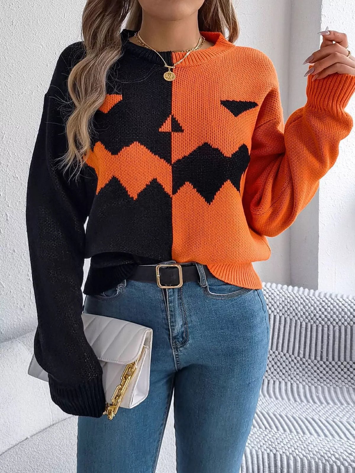 Pumpkin Face Graphic Two Tone Sweater in orange and black, front view