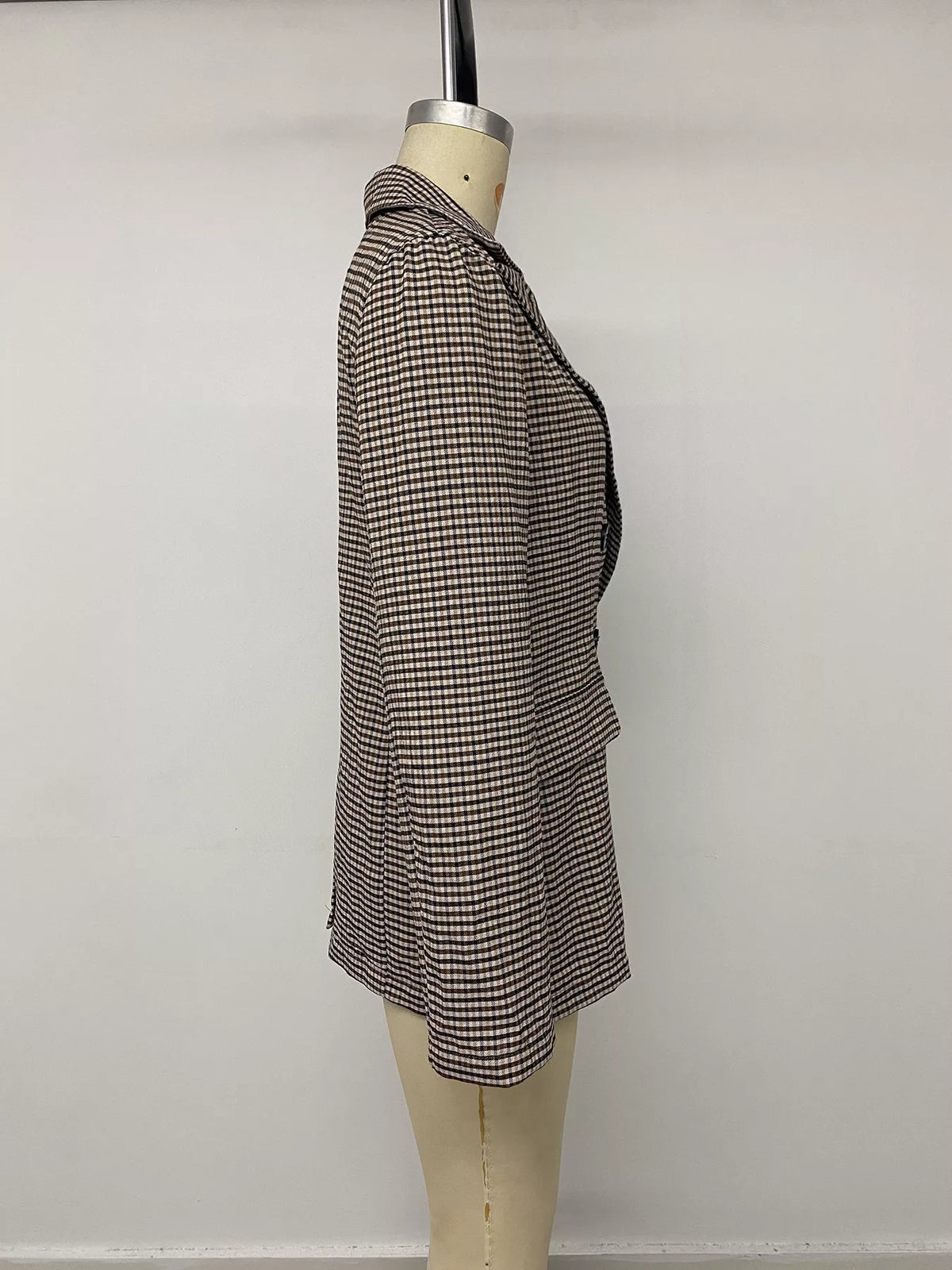 Brown plaid double-breasted blazer, side on mannequin