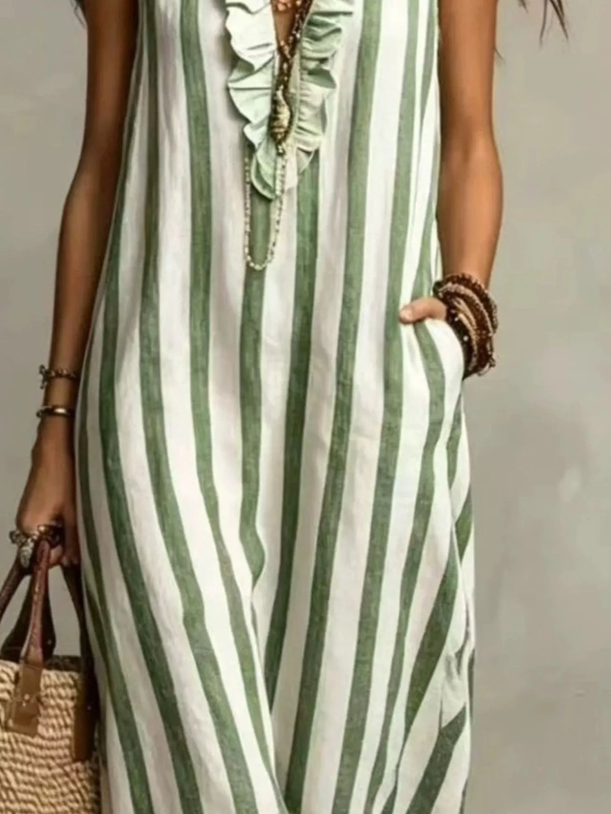 Green and white striped sleeveless maxi dress, neckline and stripe detail