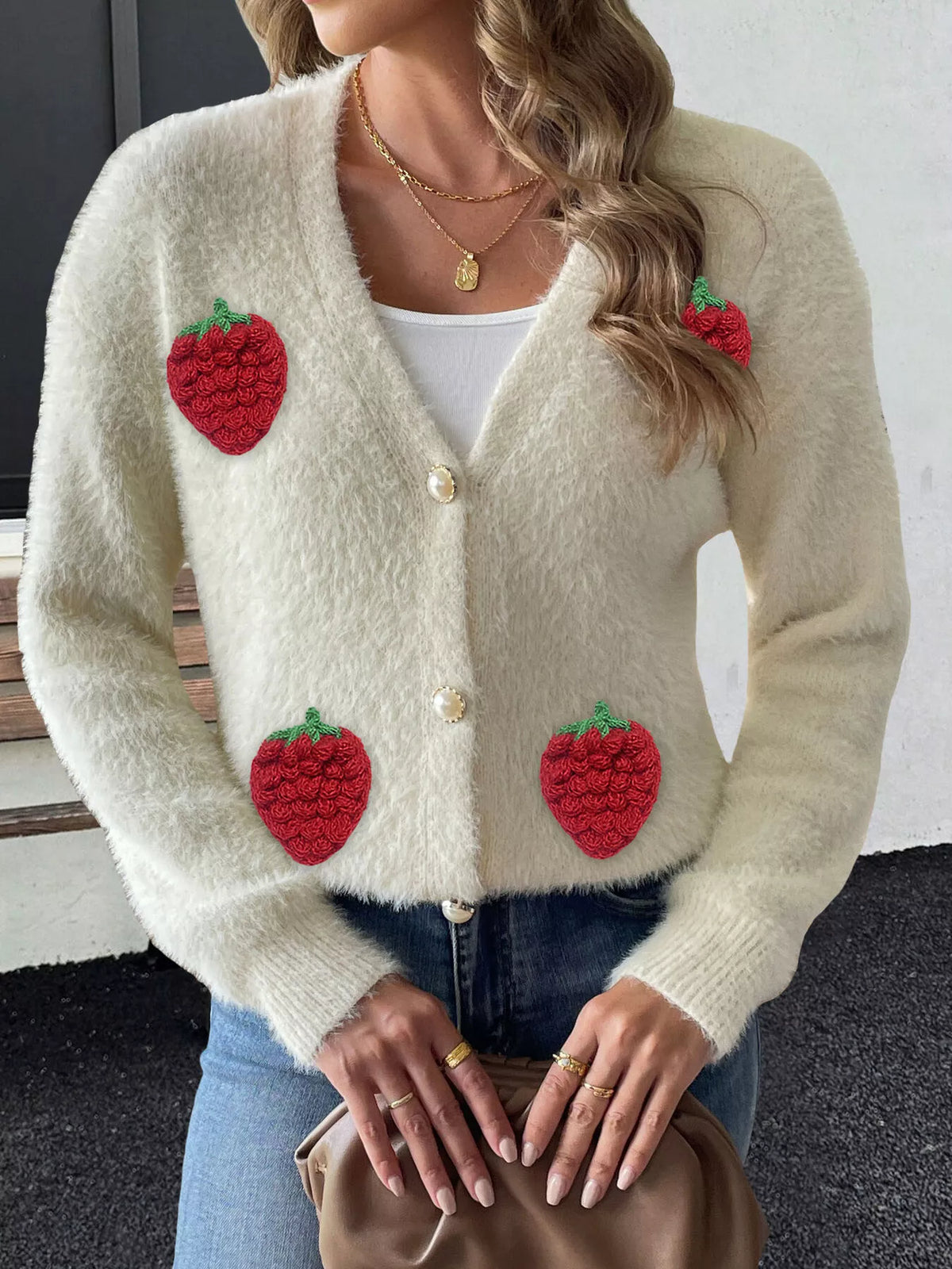Cream strawberry-applique cardigan, front detail