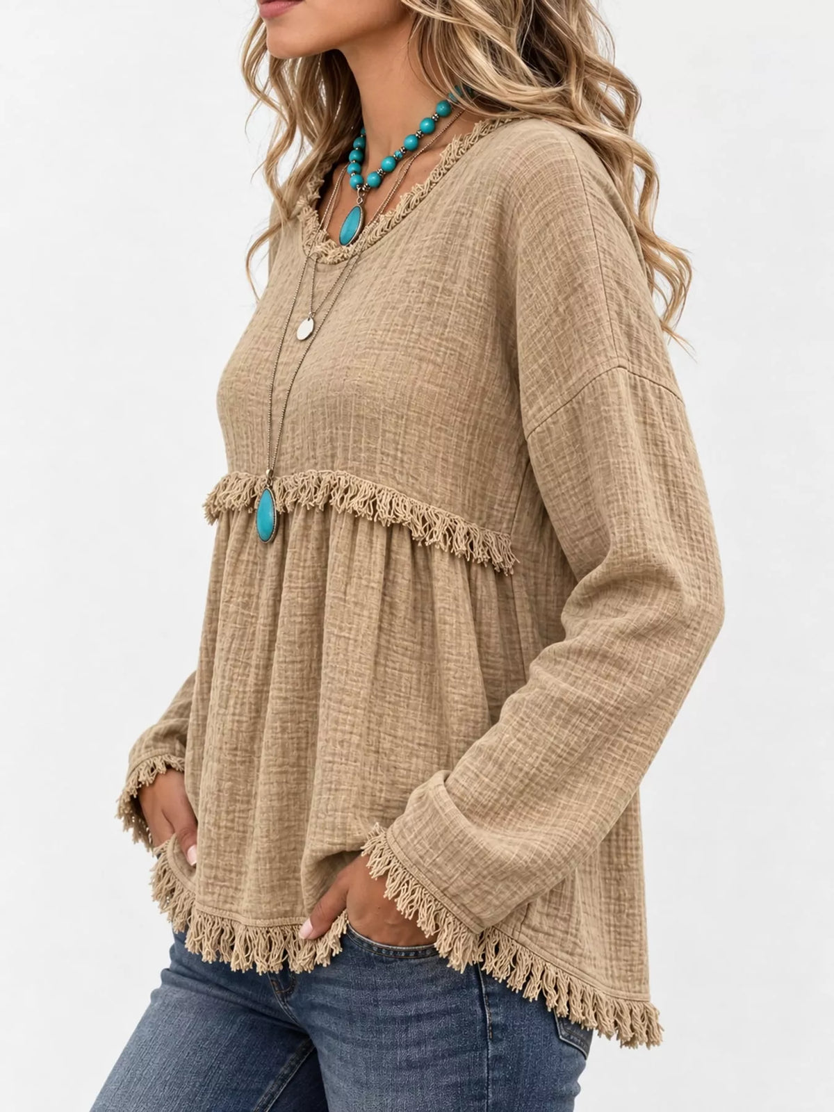 Beige frayed hem textured blouse, side view