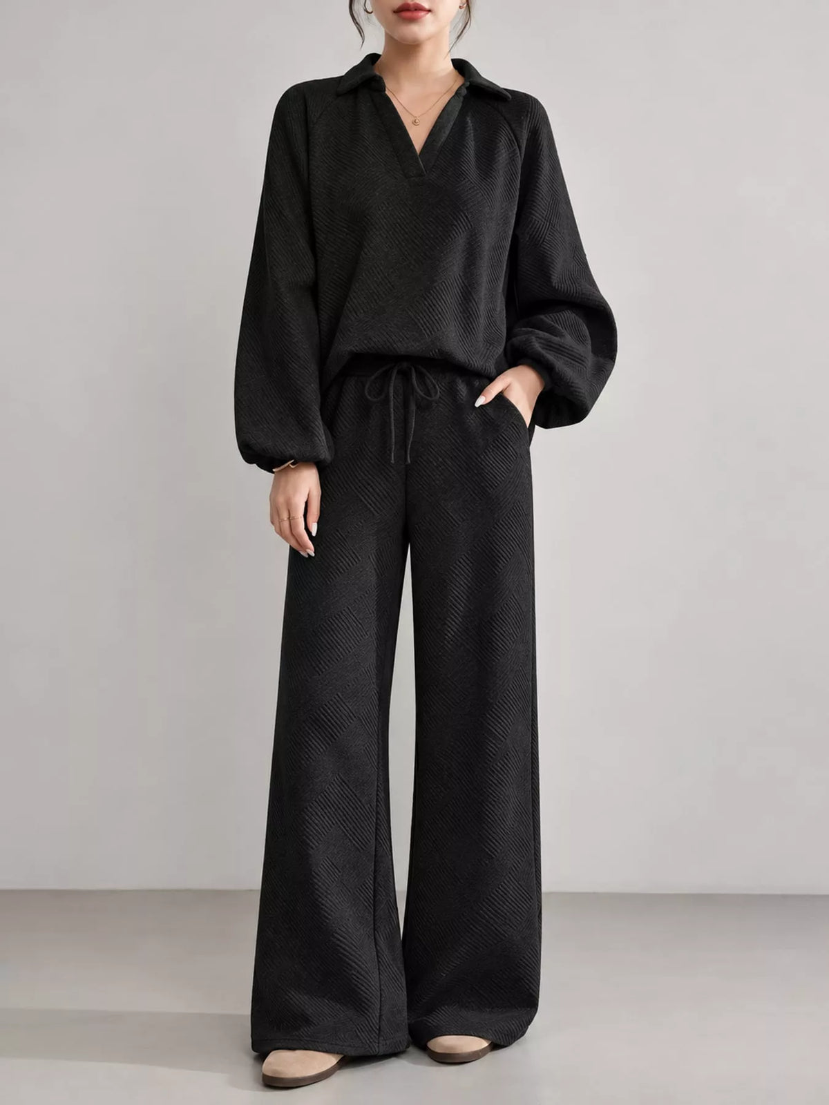 Black textured polo collar top and wide-leg pants set — front view