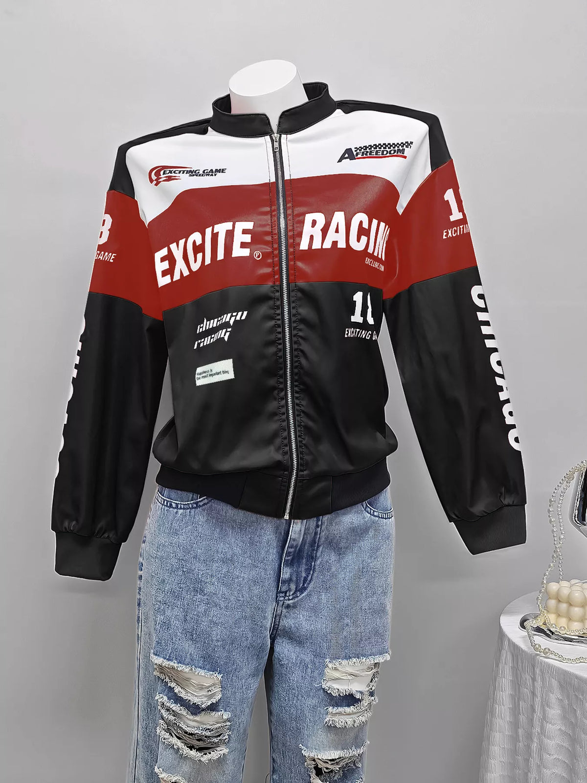 Black and red letter-print zip-front jacket, front on mannequin