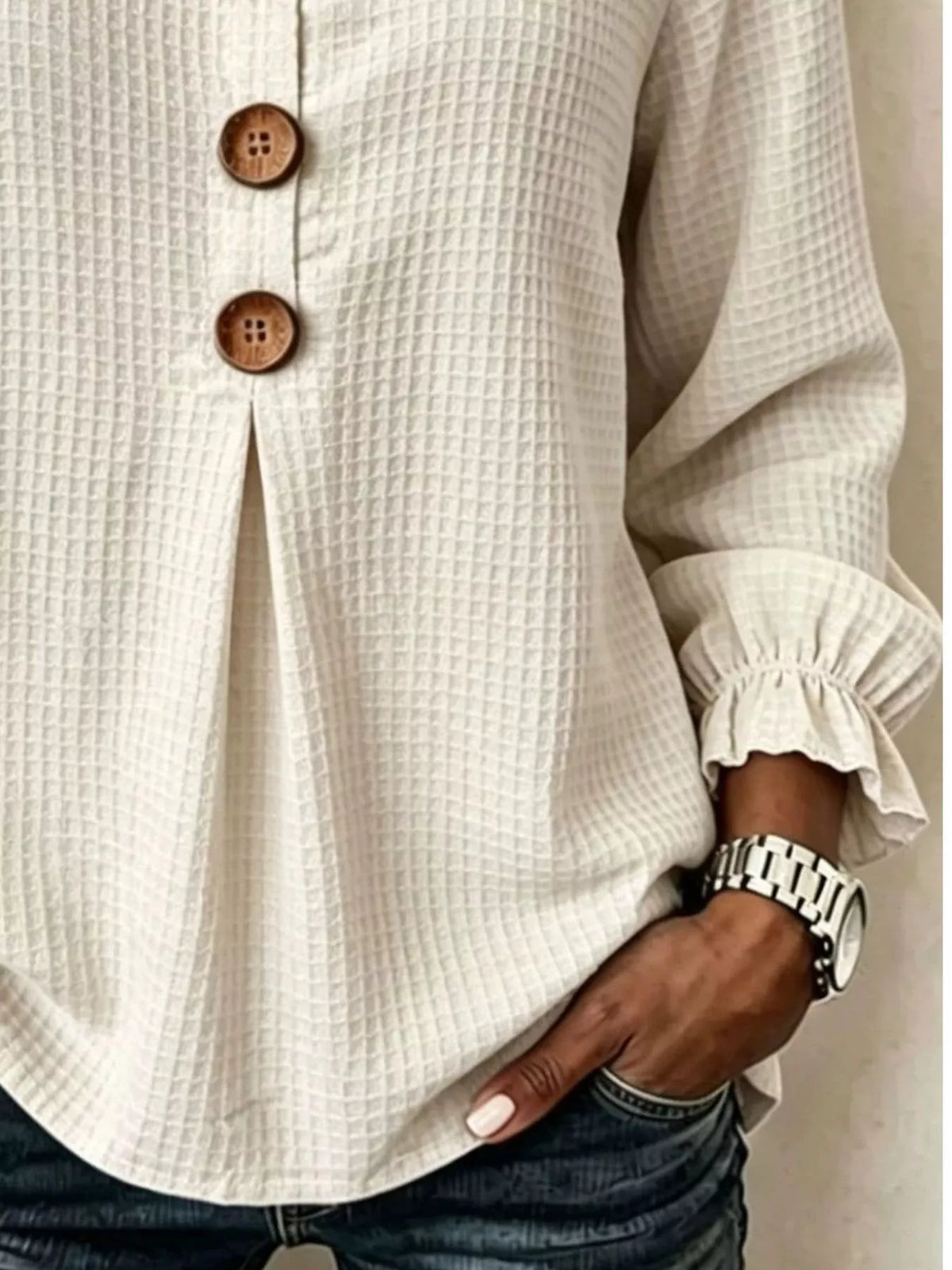 Cream waffle knit blouse, waffle texture and flounce cuff