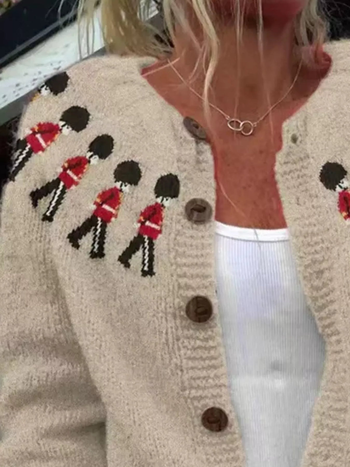 Tan British guard pattern cardigan, shoulder motif detail