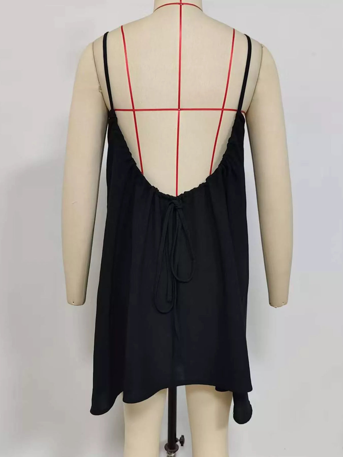 Black spaghetti strap A-line mini dress with open tie back, open back view
