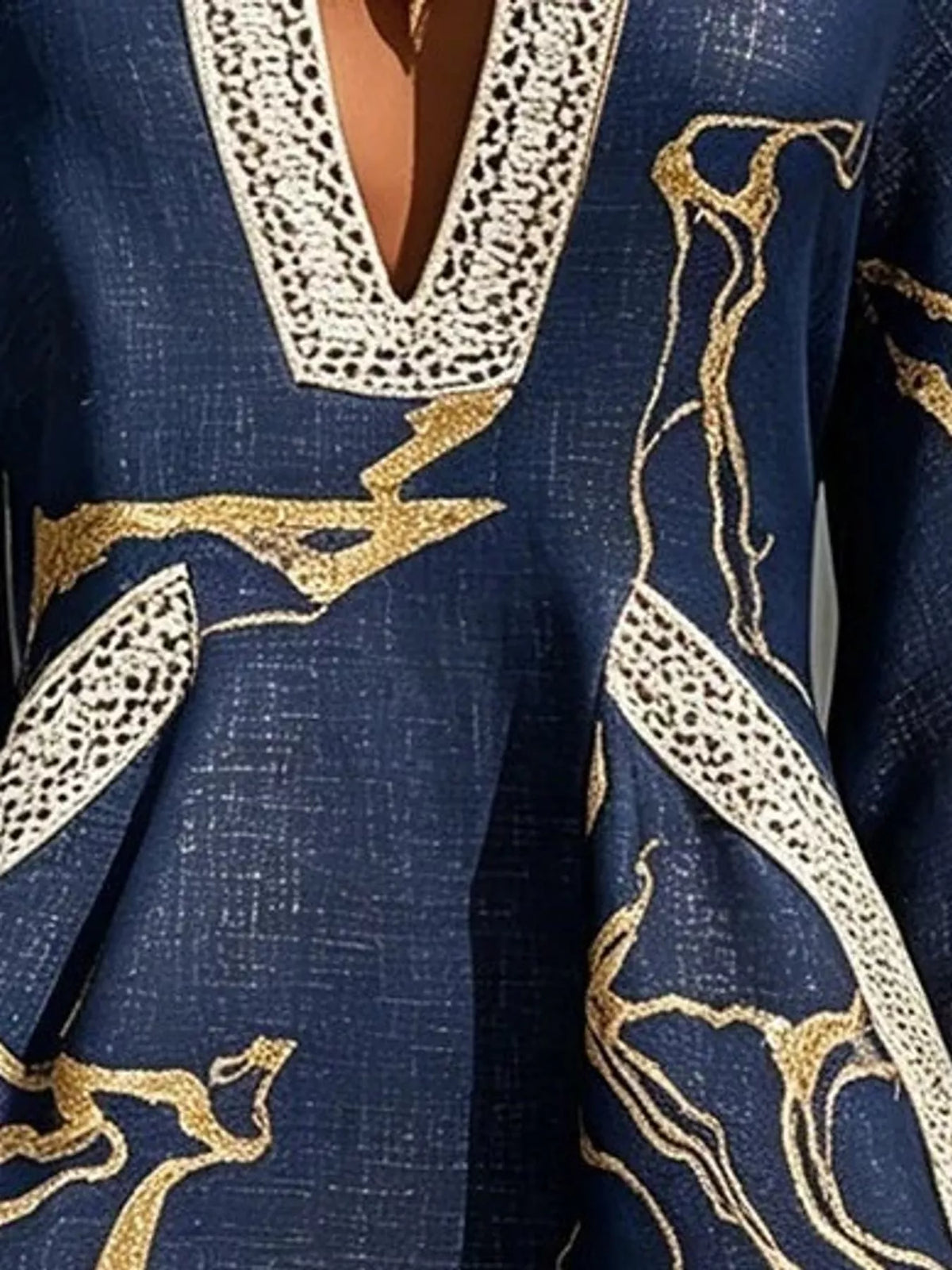 Navy notched 3/4 sleeve mini dress, close-up of neckline and pocket trim