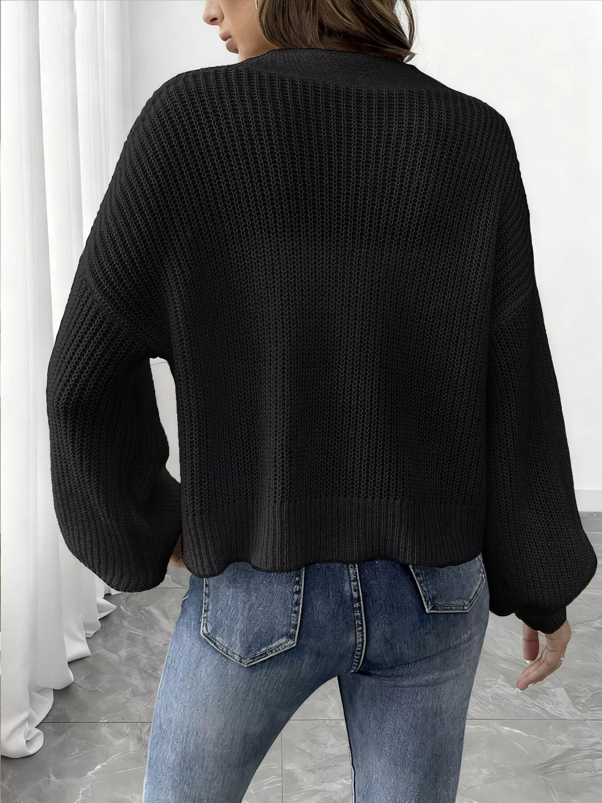 V-neck ribbed knit cardigan in black, back view