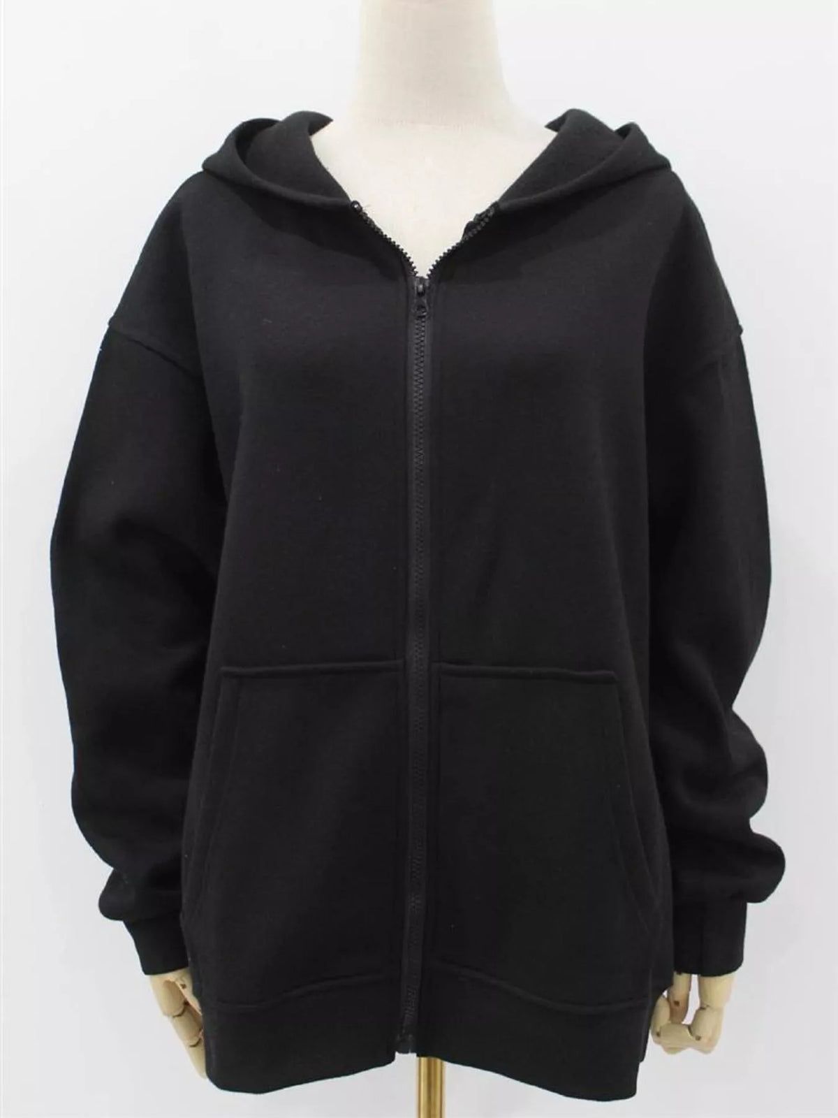 Women's Zip-Up Dropped Shoulder Hoodie in black — mannequin front view
