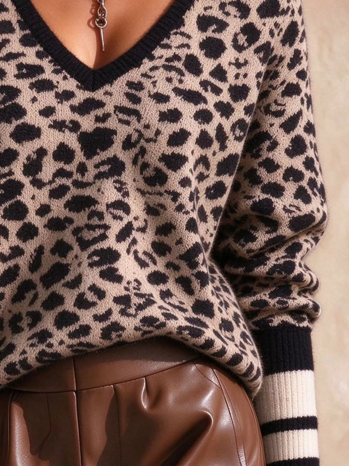 Women's Leopard V-Neck Sweater with Striped Cuffs in black leopard — cuff detail view