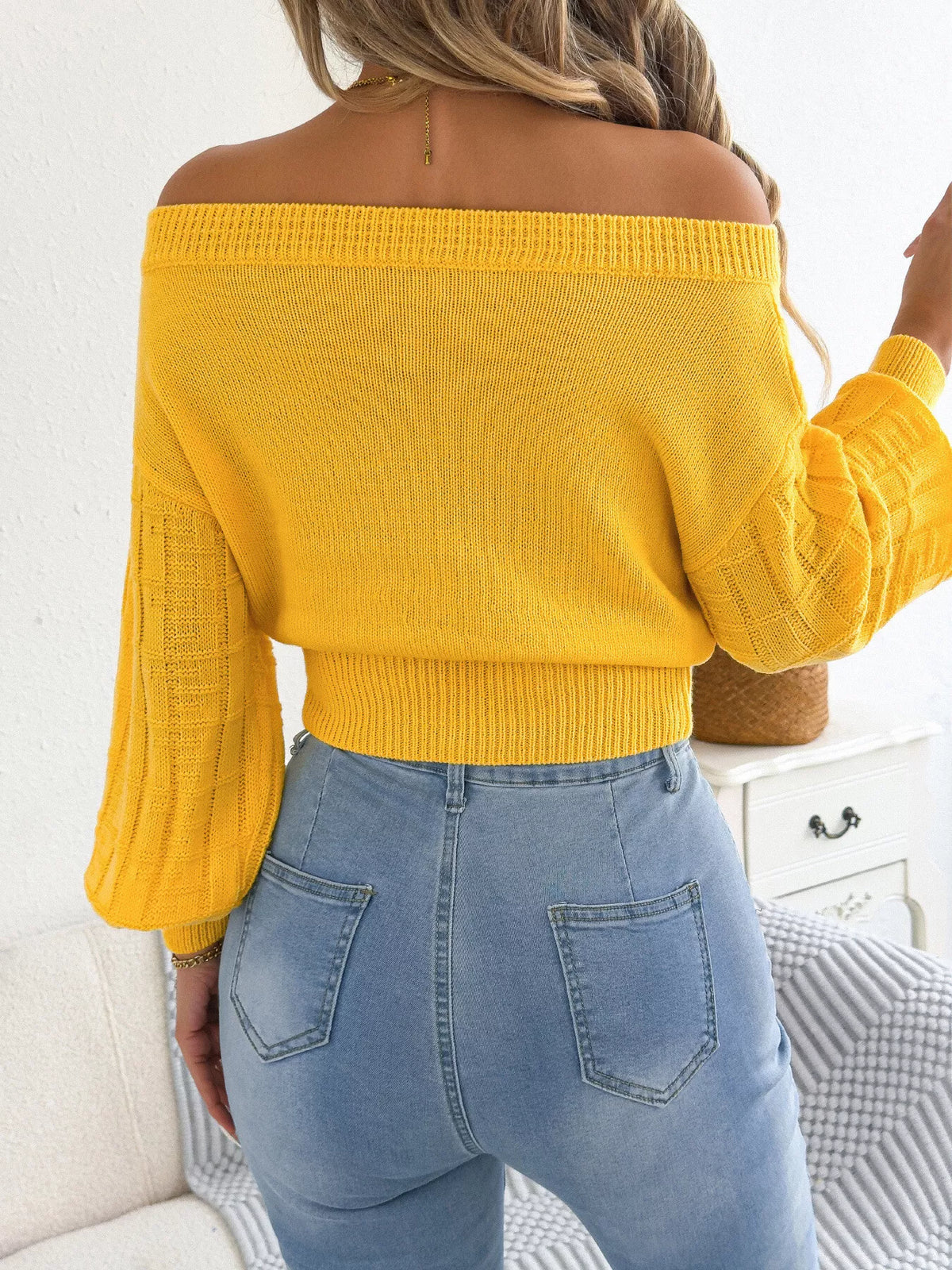 Off-shoulder openwork cropped sweater, back view