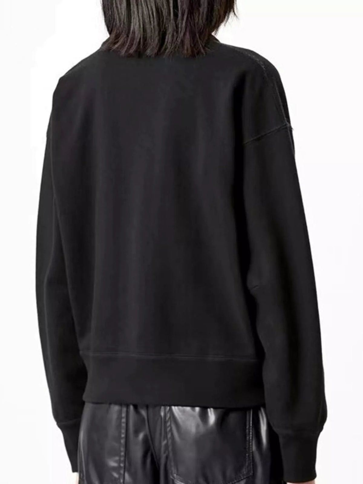 Black v-neck dropped shoulder graphic sweatshirt, back view