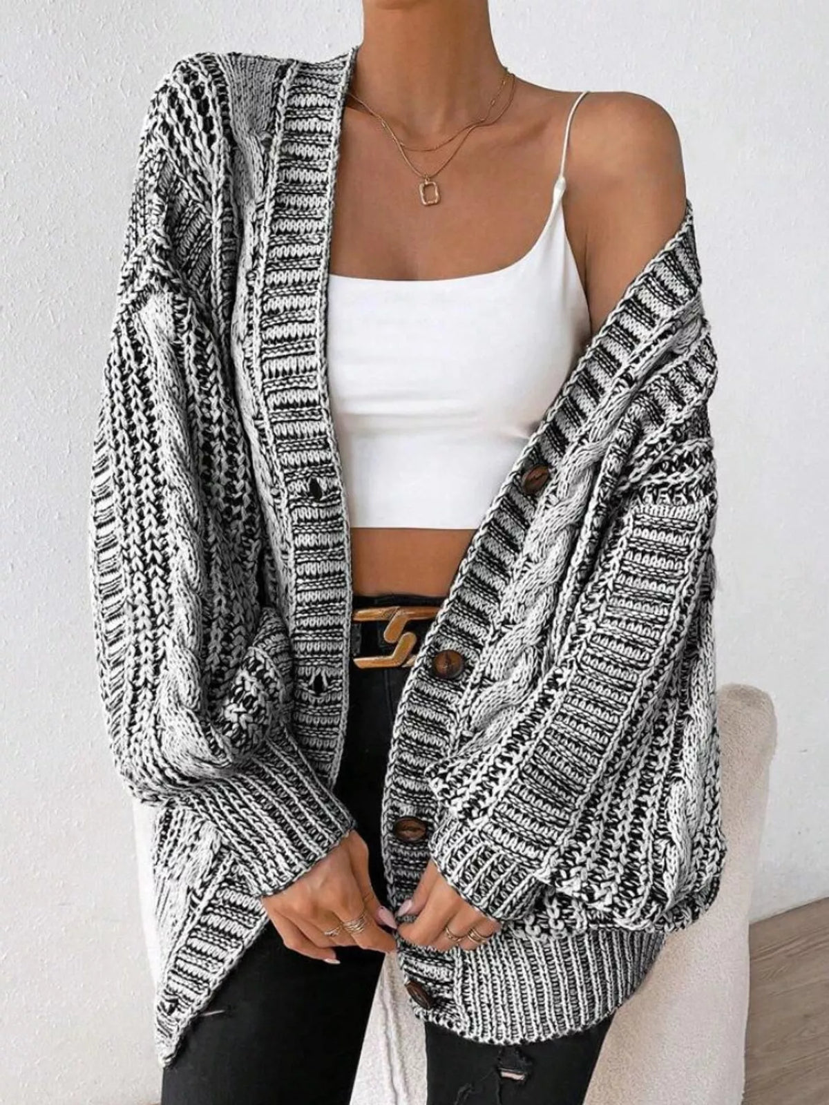 Gray chunky cable knit button down cardigan, front view