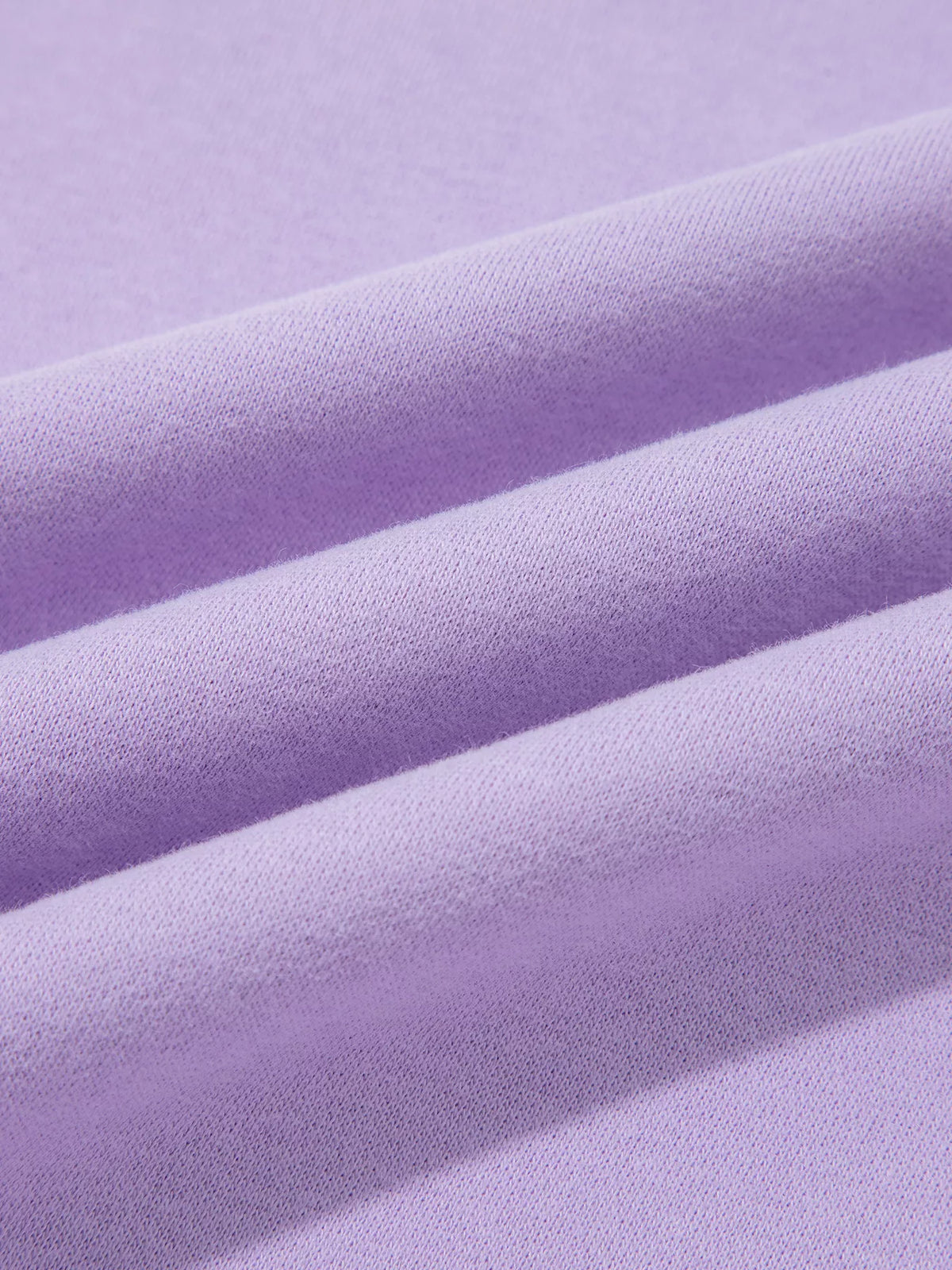 JESUS letter-patch sweatshirt, lilac fabric close up