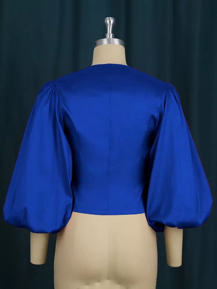 Royal blue double-breasted puff sleeve blouse, back view