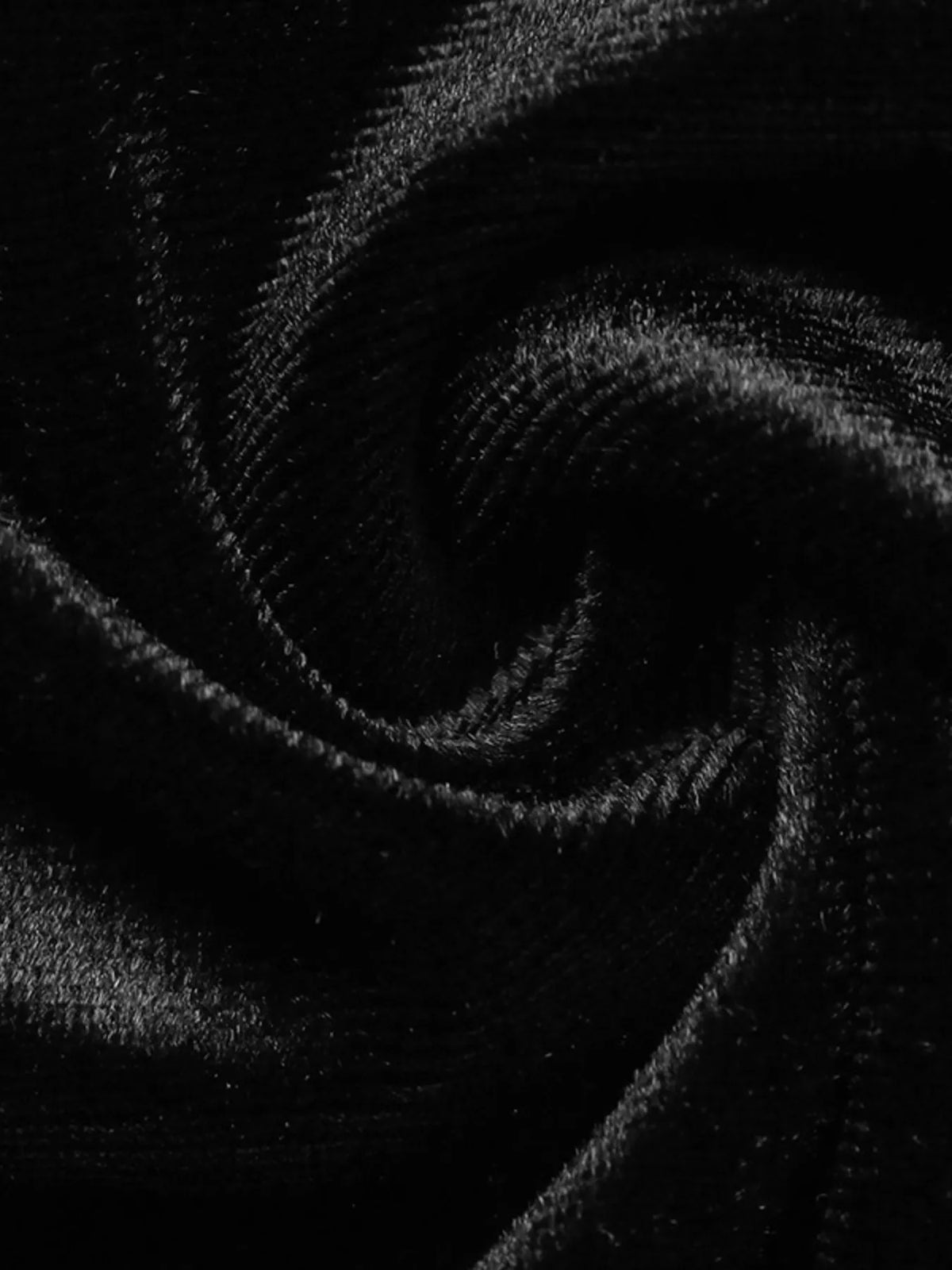 Black velvet mini skirt with lace trim, velvet texture close-up